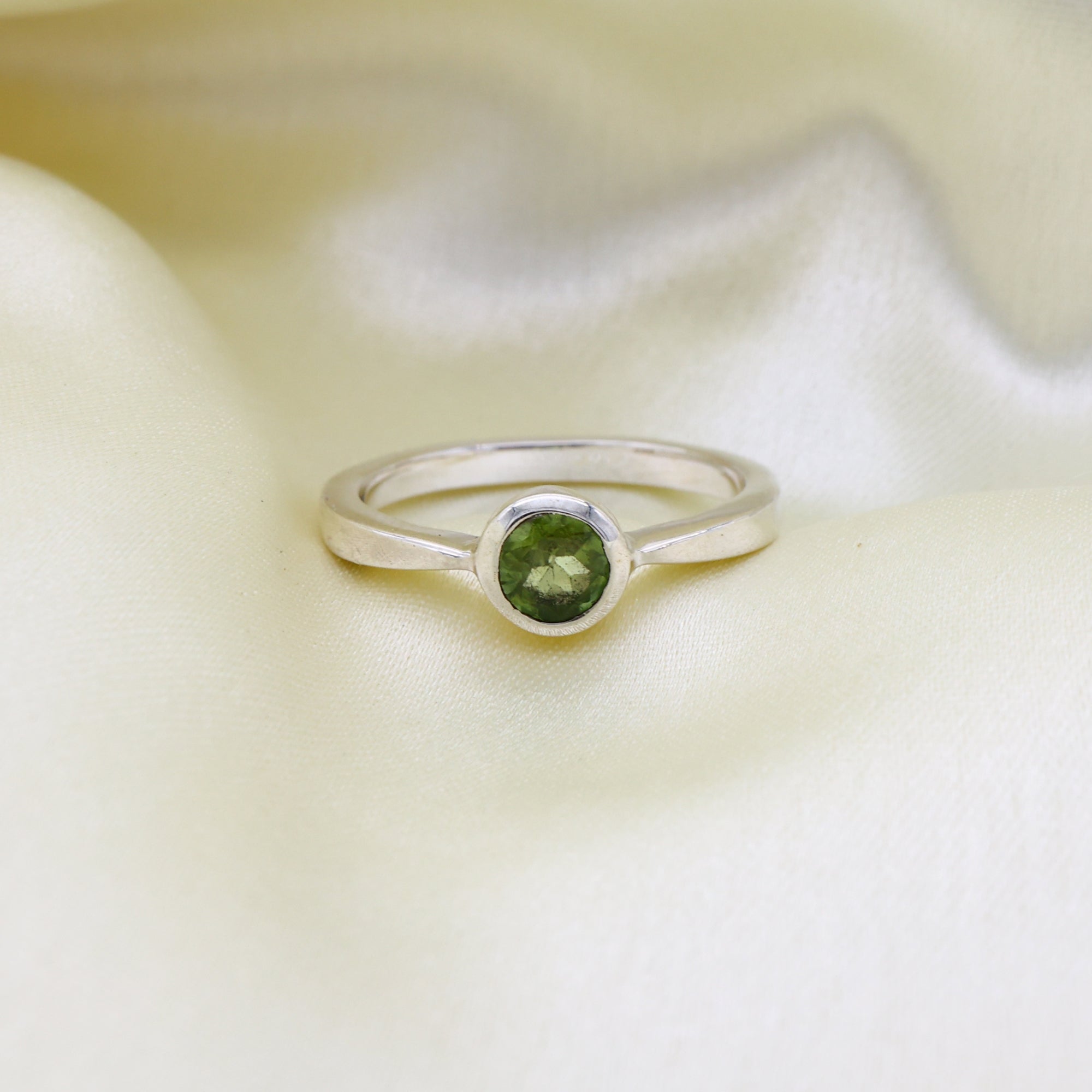 Natural Round Peridot Ring in Bezel Set